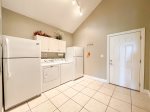 MAIN FLOOR LAUNDRY WITH 2 EXTRA REFRIGERATORS OFF THE KITCHEN